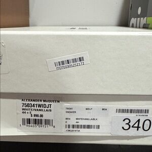 Alexander McQueen shoes in Box. White and Gold color